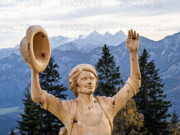 Hiker waving hat