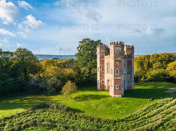 The Belvedere Tower over Powderham Park from a drone in Autumn Colors