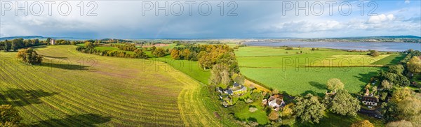 The Belvedere Tower over Powderham Park from a drone in Autumn Colors