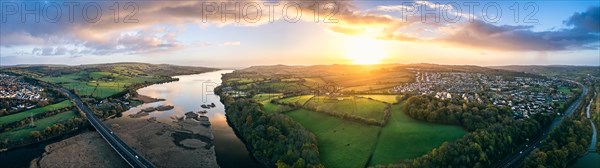 Panorama of Sunrise over Newton Abbot Bridge and River Teign from a drone