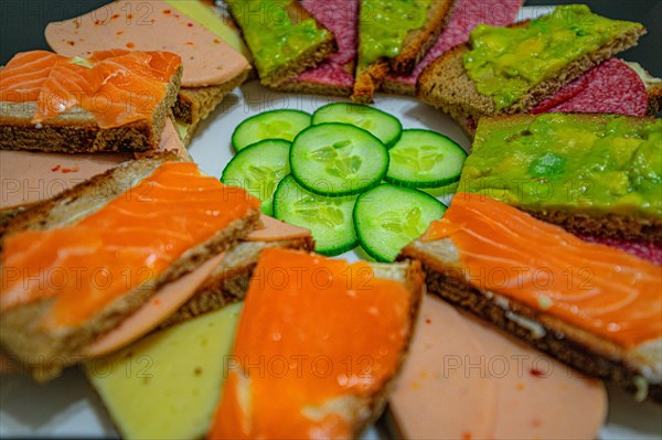 A bread plate with small canapes and various jumble