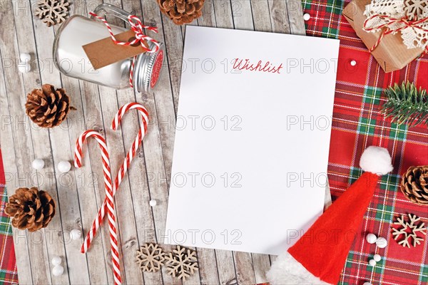 Christmas wish list surrounded by seasonal decoration