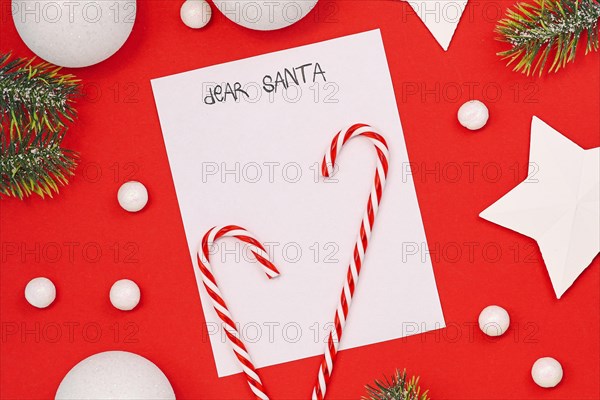 Seasonal Christmas holiday flat lay with concept for children letter to Santa Claus with white empty letter