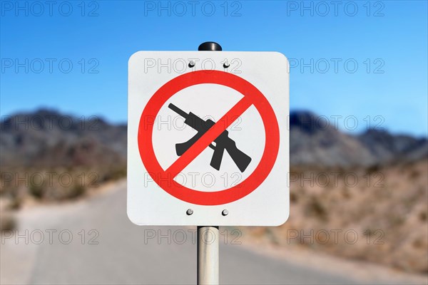 No weapons sign with machine gun crossed out in red