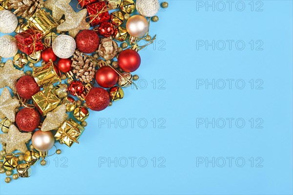 Christmas flat lay with red and golden ornaments like red tree baubles