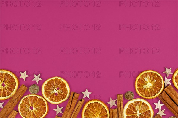 Seasonal flat lay with natural dried orange slices