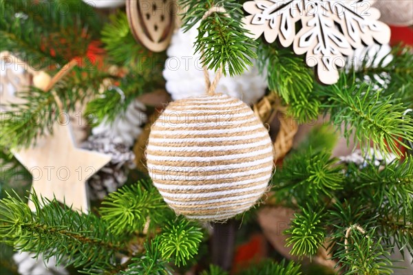Natural Christmas tree ornament bauble made from beige and white jute rope