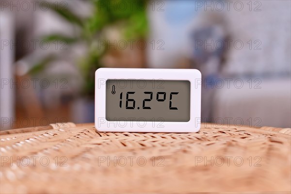 Digital thermometer showing cold room temperature of 16.7 degree Celsius