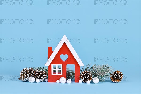 Seasonal winter decoration with small red house