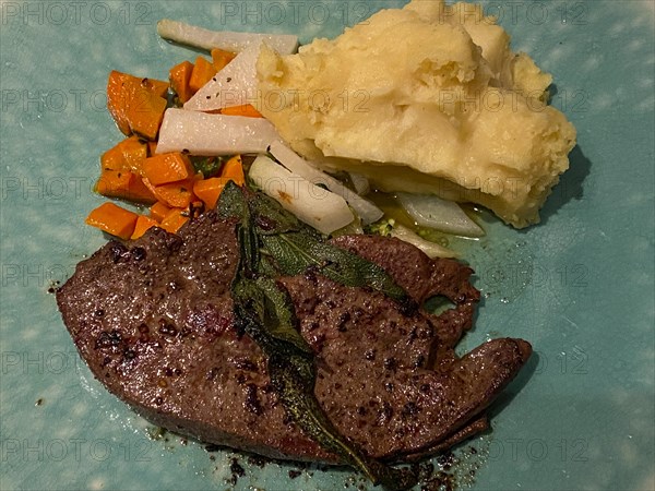 Veal liver grilled with mashed potatoes and sage
