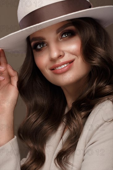 Beautiful sexy woman in a fashionable hat