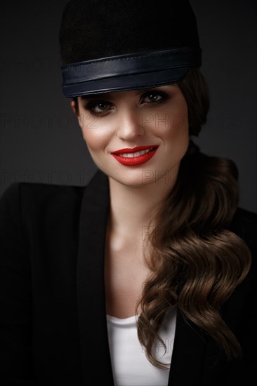 Beautiful sexy woman in a fashionable hat