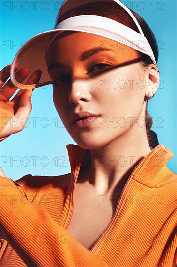 Beautiful attractive woman in a trendy swimsuit with sports equipment and accessories. Fashion photo session. beauty face