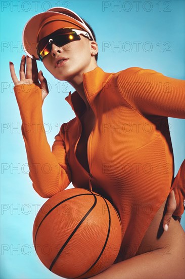 Beautiful attractive woman in a trendy swimsuit with sports equipment and accessories. Fashion photo session. beauty face