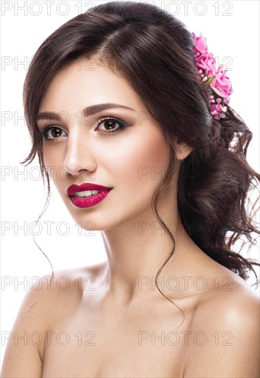 Portrait of a beautiful girl in image of the bride with purple flowers on her head. Beauty face. Photo shot in the Studio on a white background