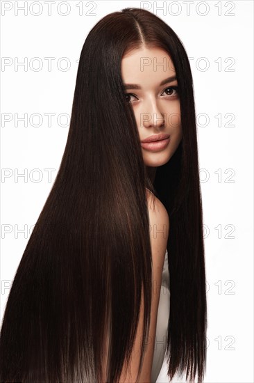 Beautiful brown-haired girl with a perfectly smooth hair