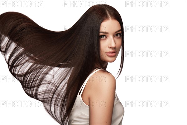 Beautiful brown-haired girl with a perfectly smooth hair