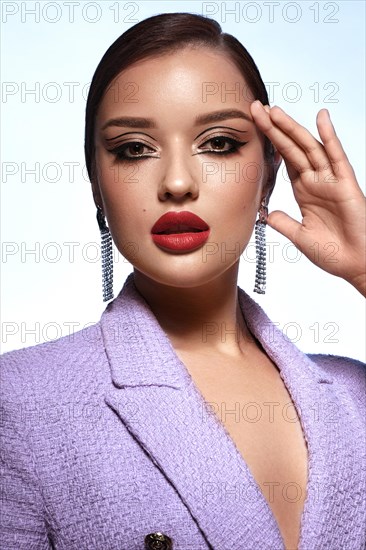 Portrait of a beautiful woman with creative makeup in a fashion style. Beauty face
