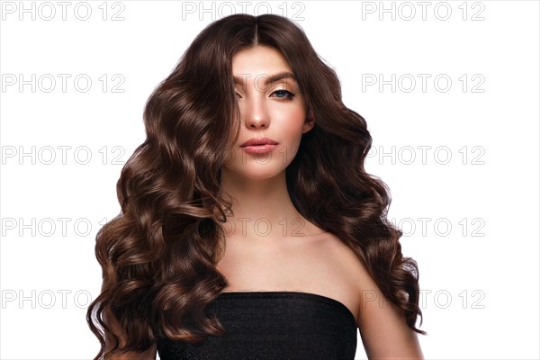 Beautiful brown-haired girl with a perfectly curls hair