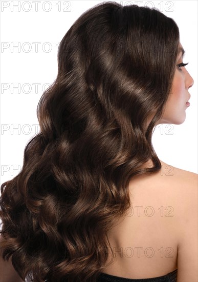 Beautiful brown-haired girl with a perfectly curls hair