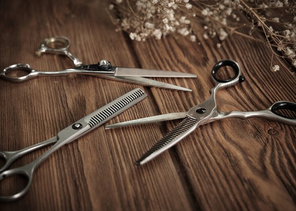 Hairdressing tools scissors closeup on wooden background. Close up