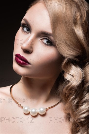 Beautiful blonde in a Hollywood manner with curls