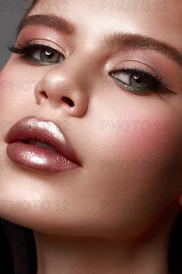 Beautiful girl with classic festive make up. Beauty face. Photos shot in studio