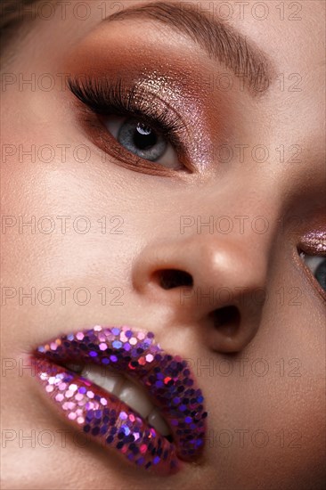 Beautiful girl with creative glitter make-up. Beauty face. Photos shot in studio