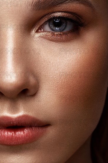 Close-up portrait of a woman with classic make-up. Beauty face. Photo taken in the studio