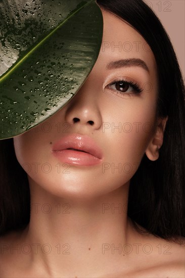 Beautiful delicate woman with nude makeup and perfect skin. Beauty face. Spa salon