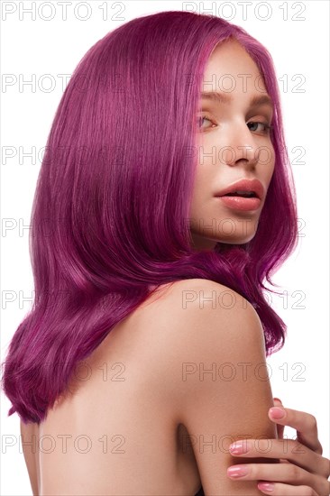 Beautiful girl with multi-colored hair and classic make-up and hairstyle. Beauty face. Photo taken in the studio