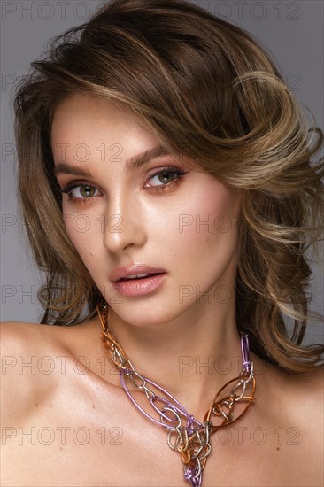 Beautiful woman with classic nude make-up