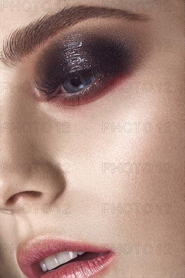 Beautiful fashion woman with creative makeup. beauty face. Close-up portrait. Photos shot in the studio