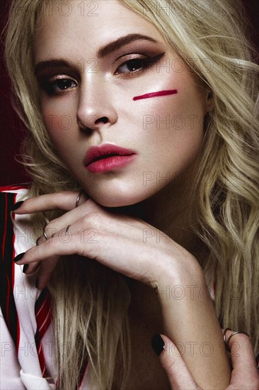 Beautiful girl with art make up in white striped shirt. beauty face. Photos shot in studio