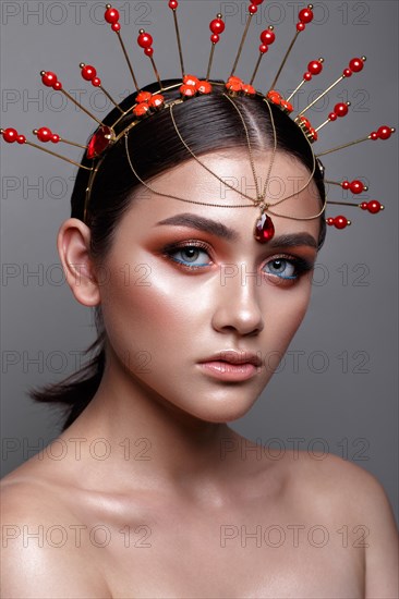 Beautiful girl with creative colorful make up. Beauty face. Photos shot in studio