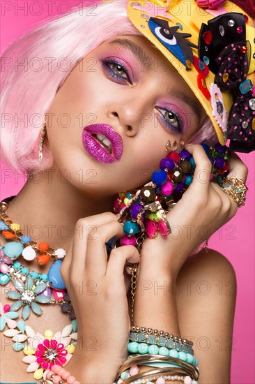 Funny comic girl with bright make-up in the style of pop art. Creative image. Beauty face. Photo taken in the studio