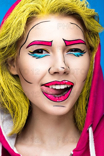 Photo of surprised young woman with professional comic pop art make-up. Creative beauty style. Photos shot in studio