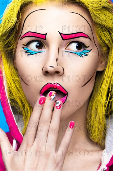 Photo of surprised young woman with professional comic pop art make-up and design manicure. Creative beauty style and nails. Photos shot in studio