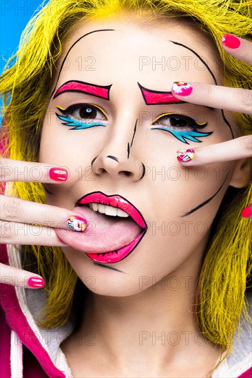 Photo of surprised young woman with professional comic pop art make-up and design manicure. Creative beauty style and nails. Photos shot in studio