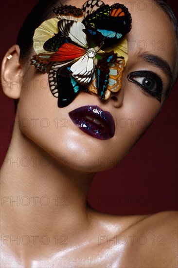 Beautiful girl with bright creative make-up and graphic arrows. Beauty face. Photos shot in studio