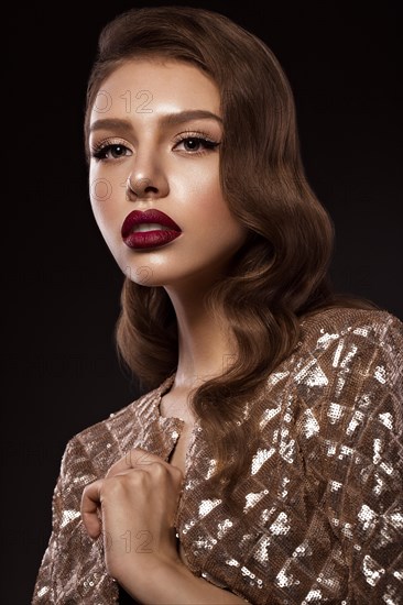 Beautiful girl in Hollywood image with wave and classic makeup. Beauty face. Photo taken in the studio