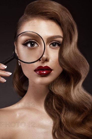 Beautiful girl in Hollywood image with wave and classic makeup. Beauty face. Photo taken in the studio