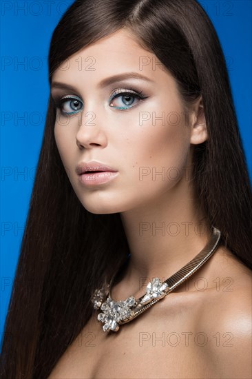 Beautiful woman with evening make-up and long straight hair