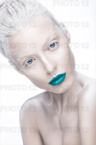 Beautiful girl in the image of albino with blue lips and white eyes. Art beauty face. Picture taken in the studio on a white background