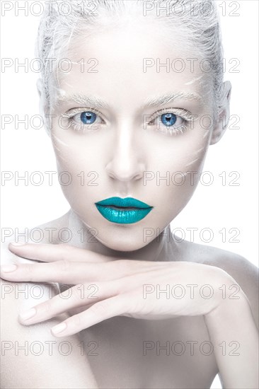 Beautiful girl in the image of albino with blue lips and white eyes. Art beauty face. Picture taken in the studio on a white background