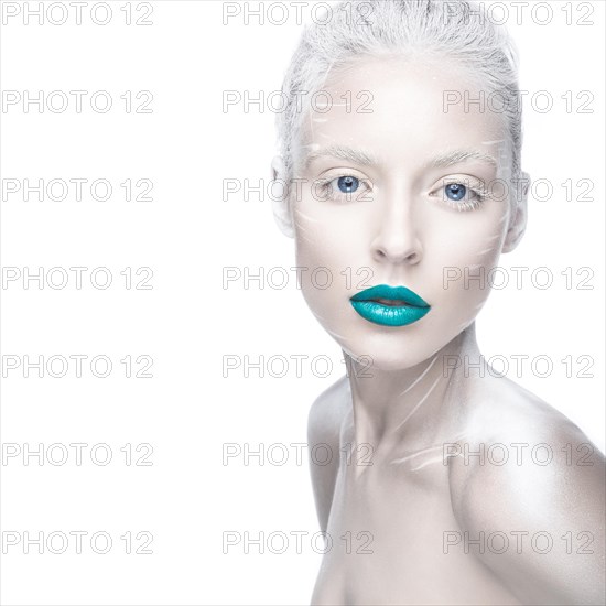 Beautiful girl in the image of albino with blue lips and white eyes. Art beauty face. Picture taken in the studio on a white background