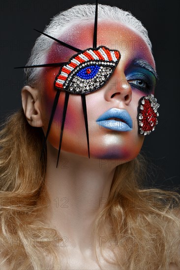 Beautiful girl with creative make-up in pop art style. Beauty face. Photo taken in studio