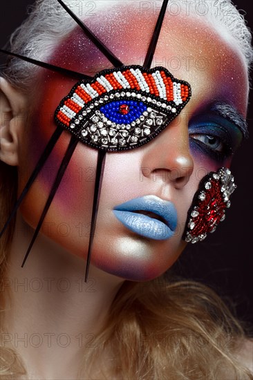 Beautiful girl with creative make-up in pop art style. Beauty face. Photo taken in studio