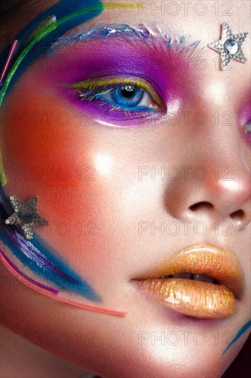 Beautiful girl with creative make-up in pop art style. Beauty face. Photo taken in studio