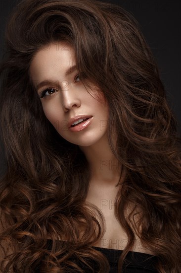 Beautiful brunette model with volume curls